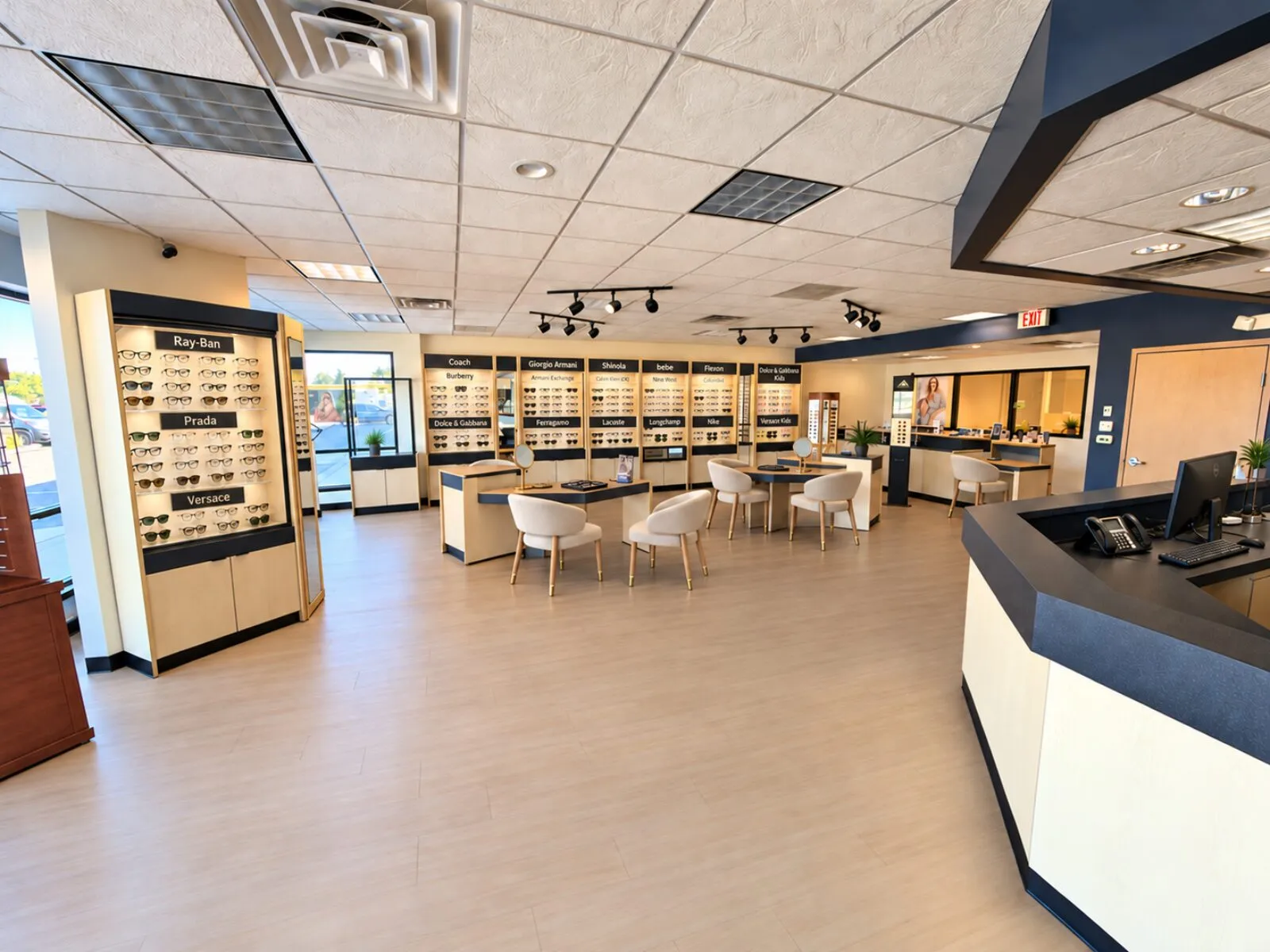 The Lens Society showroom, with frame displays along the walls and fitting tables in the center